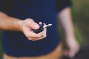 Customer with a key to a car